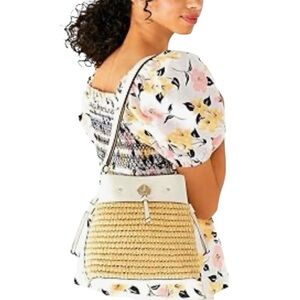 Kate Spade Marti Small Bucket Bag is woven straw exterior and leather trim